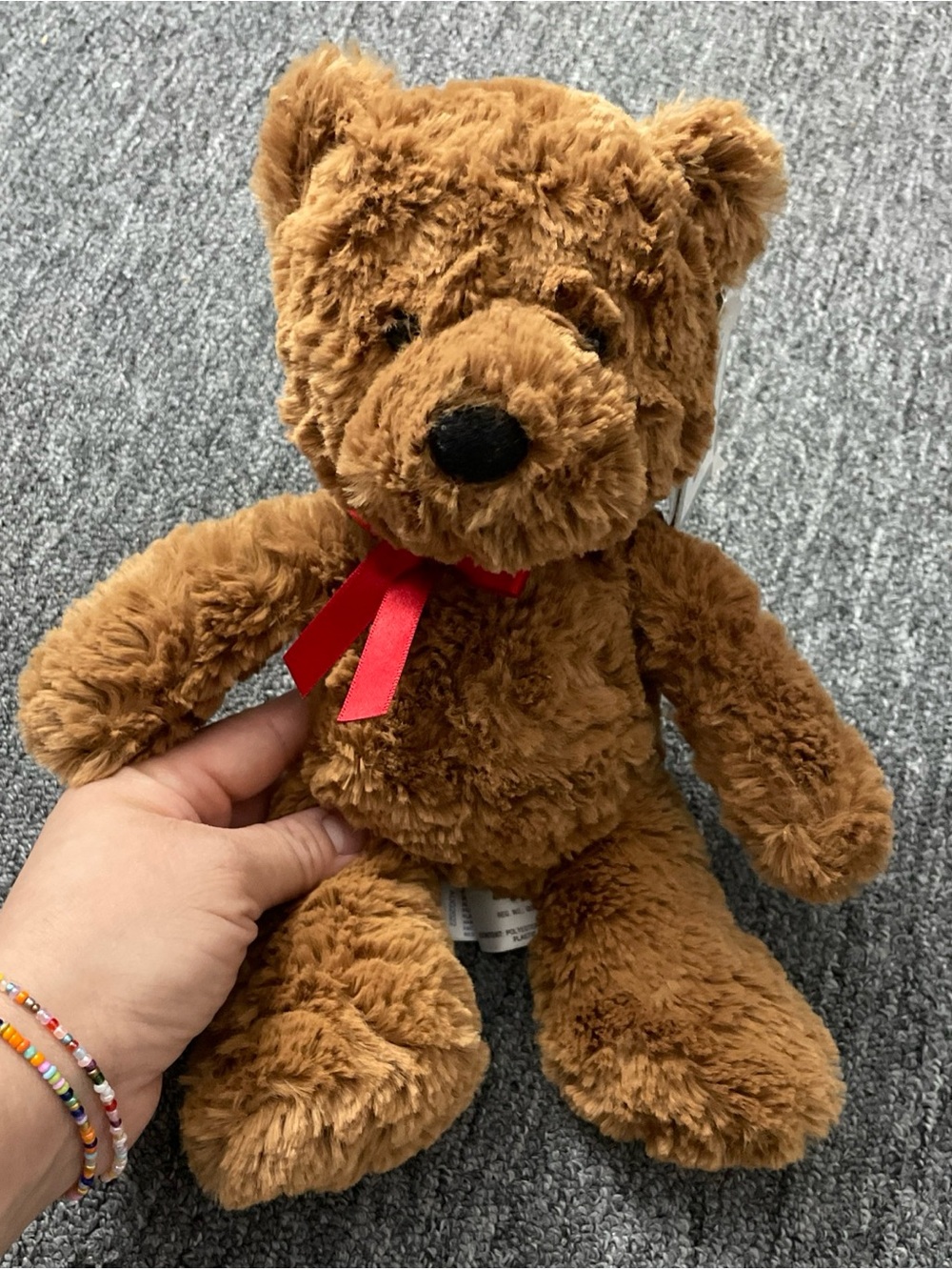 Aurora Jackson Plush Brown Teddy Bear with Red Ribbon